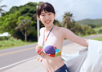 An elegant Japanese & Asian gravure idol (swimsuit model), actress & singer, wearing a color bra and blue shorts, her name is Ms. Mikoto.