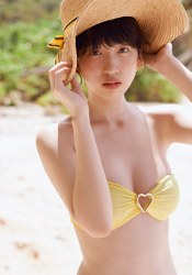 A Japanese & Asian gravure idol (pin-up girl), actress, and singer wearing a yellow bikini, her name is Ms. Mikoto, she is wearing a straw hat.