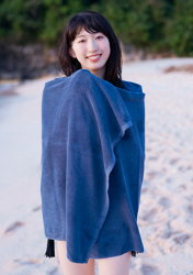 A Japanese & Asian gravure idol (pin-up girl), actress & singer in a black bikini is wearing a blue bath towel, and her name is Ms. Mikoto Hizaka.