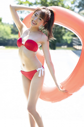 Ms. Yuina has a red bikini and a big float in her hand, she is a Japanese & Asian fashion model, actress and swimsuit model (gravure idol, bikini model).