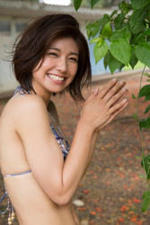 Ms. Yukina Fujihana is wearing a dark blue bikini swimsuit (with a flower pattern), she is a beautiful & cute Japanese & Asian gravure idol (bikini model), TV personality, actress.