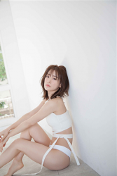 Ms. Yumina Fukue is wearing a white lady underwear, she is sitting on the floor grasping her knees, she is a beautiful and cute Japanese & Asian TV personality swimsuit model (gravure idol, bikini model, pin-up girl).