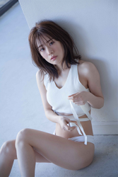 Ms. Yumina Fukue is wearing a white lady underwear, she is sitting on the floor grasping her knees, she is a beautiful and cute Japanese & Asian TV personality swimsuit model (gravure idol, bikini model, pin-up girl).