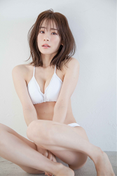 Ms. Yumina Fukue is wearing a white bikini swimsuit, she is sitting on the floor grasping her knees, she is a beautiful and cute Japanese & Asian TV personality swimsuit model (gravure idol, bikini model, pin-up girl).
