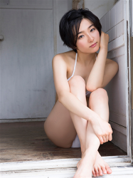 Ms, Yuusa is a beautiful & lovely young Japanese gravure idol (swimwear model) & actress, wearing a white bikini swimsuit, she is sitting on the floor grasping her knees.