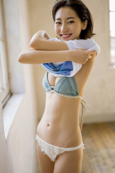 Ms. Karena Takeoka is taking off her shirt, showing her blue bra and white panties, she is a cute and elegant Japanese actress (Asian actress), bikini model (gravure idol, swimsuit model, pin-up model), fashion model.