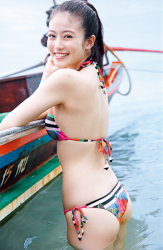 Ms. Mioka Imawatari is wearing a bikini swimsuit with a gorgeous design (red is the main), she is in the sea, her feet are in the sea, and there is a boat beside her, she is a beautiful and cute Japanese actress (Asian actress), gravure idol (bikini model, swimwear model, pin-up model), TV personality, Her bust is 86cm, and she has beautiful breasts.