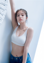 Ms. Mioka Imawatari wears white sports bra and jeans, she is standing in the room, she is a beautiful and cute Japanese actress (Asian actress), gravure idol (bikini model, swimsuit model, pin-up model), TV personality, her bust is 86cm and she has beautiful breasts.