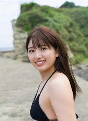 Ms. Nanane Oka is wearing a black bikini swimsuit, on the breakwater, she is a beautiful and cute Japanese & Asian gravure idol (bikini model, swimsuit model, pin-up girl) and actress.