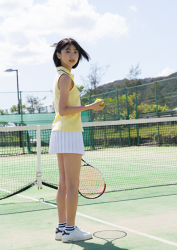 Ms. Natsuyo Ikekatsu is wearing a yellow polo shirt and white mini and is about to play tennis, she is a Japanese & Asian beautiful and cute model and actress.