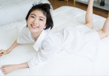 Ms. Natsuyo Ikekatsu wore a big white tailored shirt, she is lying face down on the bed, she is a Japanese & Asian beautiful and cute model & actress.