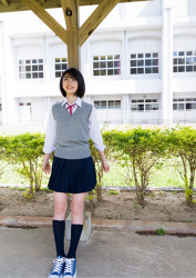 Ms. Natsuyo Ikekatsu is wearing a school uniform, she is standing inside the school building, she is a Japanese & Asian beautiful and cute model & actress.