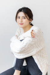 Ms. Atsumi Aonami is wearing a white sweater and jeans, she is sitting on the floor, she is a beautiful and elegant mature Japanese & Asian fashion model, her height is 173 cm, her body is very slim and pretty.