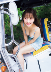 Ms. Emina is a Japanese and Asian gravure idol (swimwear model, bikini model, pin-up girl), TV personality and singer, she is wearing a light blue dress and both are sitting in a tricycle.