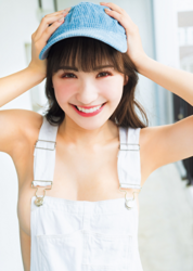Ms. Emina is a Japanese and Asian gravure idol (swimwear model, bikini model, pin-up girl), TV personality and singer, she is wearing no bra, a light blue hat, and a white dress, and she is standing.