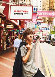 Mr. Ayato Akaibashi is standing on a street corner in hong kong, he is also an actor and voice actor.
