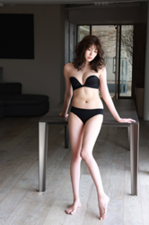 Ms. Nakasa Iwaki is a Japanese & Asian female fashion model, actress, gravure idol (bikini model, swimsuit model, pin-up model), actress and TV entertainer (TV personality), she is wearing black lingerie and she is standing.