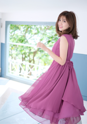 Ms. Nakasa Iwaki is a Japanese & Asian female fashion model, actress, gravure idol (bikini model, swimsuit model, pin-up model), actress and TV entertainer (TV personality), she wears a purple dress, and she's standing in a certain room.