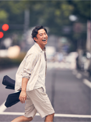 Mr. Takaatsu Sakurahaba is wearing beige summer clothes and is crossing the crosswalk, he is a handsome Japanese & Asian actor, fashion male model.