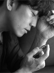 Mr. Takaatsu Sakurahaba is shown in black and white and photographed from the side, he is a handsome Japanese & Asian actor, fashion male model.
