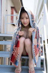 Ms. Haruko Tsubamoto is a Japanese & Asian busty gyaru swimsuit model (gravure idol / bikini model), dancer, and TV personality, she is wearing a pink bikini bathing suit and is sitting on the steps with a brown bath towel over her head and body.
