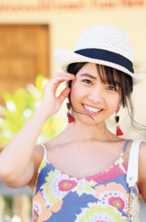 Ms. Kisara Amakura is a Japanese active idol, a very cute bikini model (gravure idol), an actress, and a TV personality, she is wearing a brightly colored dress, wearing a hat, and looking straight ahead.