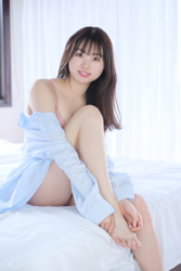 Ms. Makiko Tatsuhashi is taking off her light blue cut shirt and she is sitting on the bed, she is an active idol singer and gravure idol (bikini model, swimwear model).