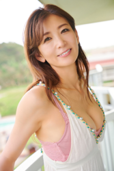 Ms. Shiori Chukyo is wearing a white camisole over pink women's underwear and she is standing on the balcony, she is a mature swimsuit model (gravure idol / bikini model) in her 50s, an actress, a yoga instructor, and a TV personality, her chest measurement is 88cm and she has big and beautiful breasts.